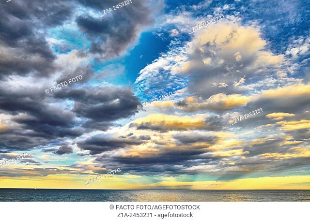 Sunset seascape with clouds at the Mediterranean sea. Denia. Alicante. Valencia Community. Spain