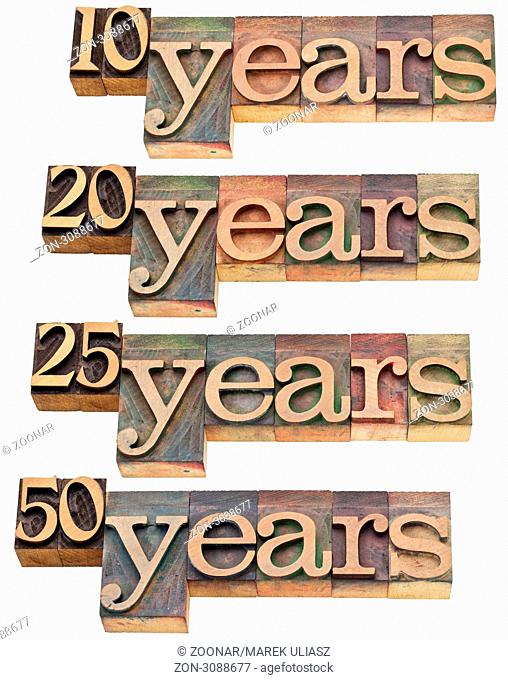 anniversary concept - 10, 20 , 25, 50 years - isolated text in vintage wood letterpress printing blocks stained by color inks