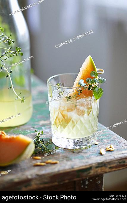 Water kefir lemonade with candied melon and lemon balm