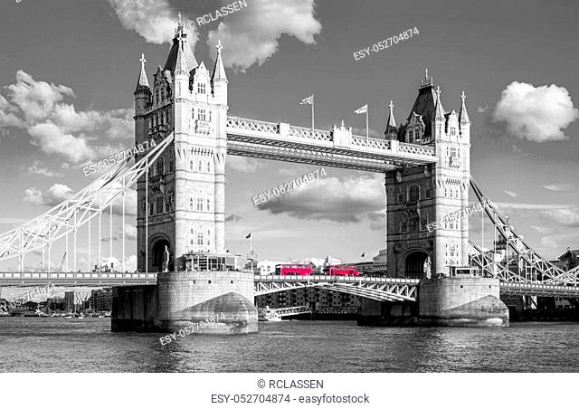 view to the tower bridge in london in black and white colors with red buses. ideal for websites and magazines layouts
