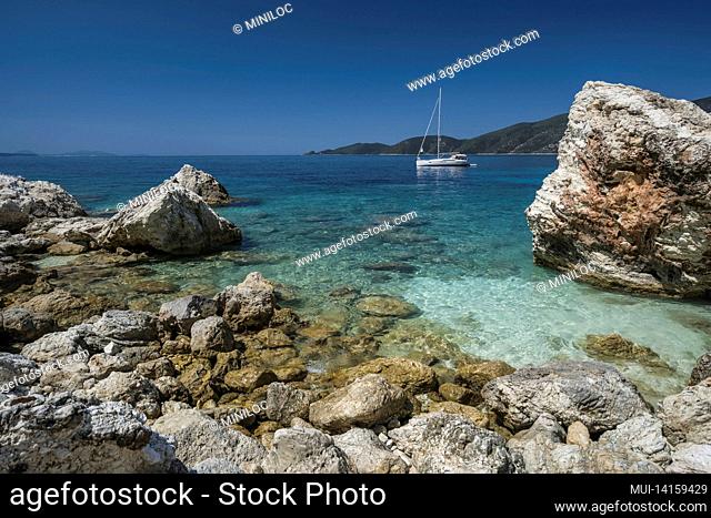 yacht boat in agiofili beach near port of vasiliki with emerald crystal clear sea, lefkada island, ionian, greece