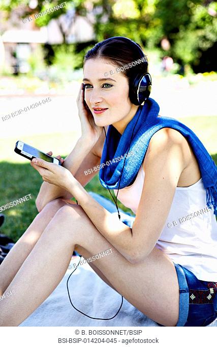 WOMAN LISTENING TO MUSIC