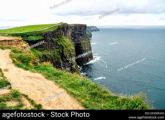 World famous Cliffs of Moher, one of the most popular tourist destinations in Ireland. view of widely known tourist attraction on Wild Atlantic Way in County...