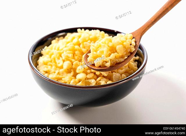 Tenkasu served in a bowl placed on a white background. An image of Japanese food. Image of Japanese food