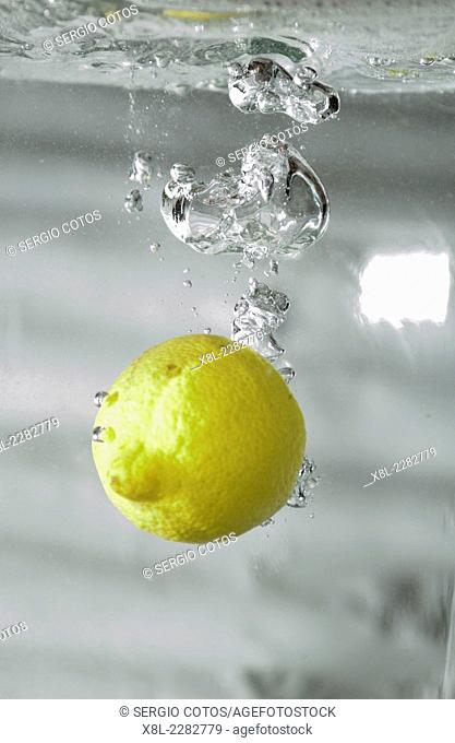 lemon submerging in water