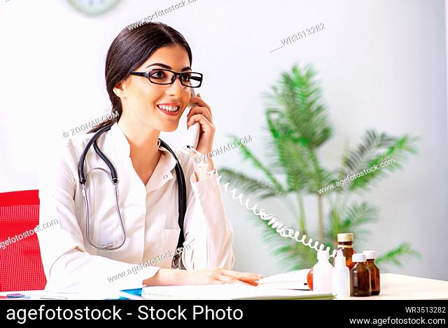 Doctor in telemedicine concept with phone
