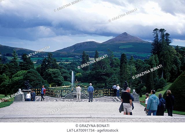 Powerscourt House drive and gardens. Open to public. People. View of mountains