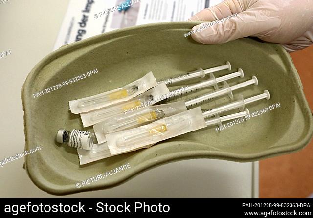 28 December 2020, Mecklenburg-Western Pomerania, Rostock: Five syringes for the vaccination of university medical staff against the Sars-CoV-2 virus are ready