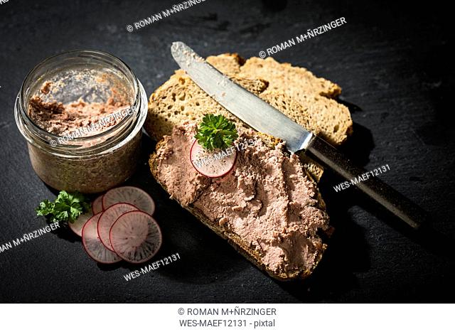 Liverwurst spread on slice of brown bread
