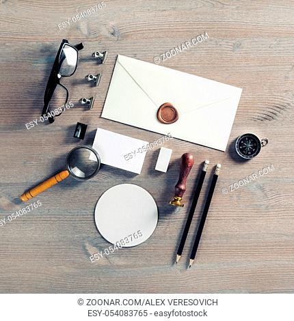 Blank envelope and stationery on wooden background. Flat lay