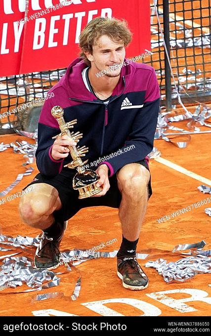 Alexander Zverev of Germany celebrates with the trophy following victory against Matteo Berrettini of Italy in the Mutua Madrid Open Final on day eleven of the...