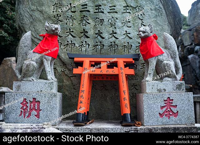 Kyoto, Japan, Asia - Stone figures depict Inari Okami, the Japanese fox (Kitsune), deity (Kami) on Mount Inariyama where the Fushimi Inari Taisha