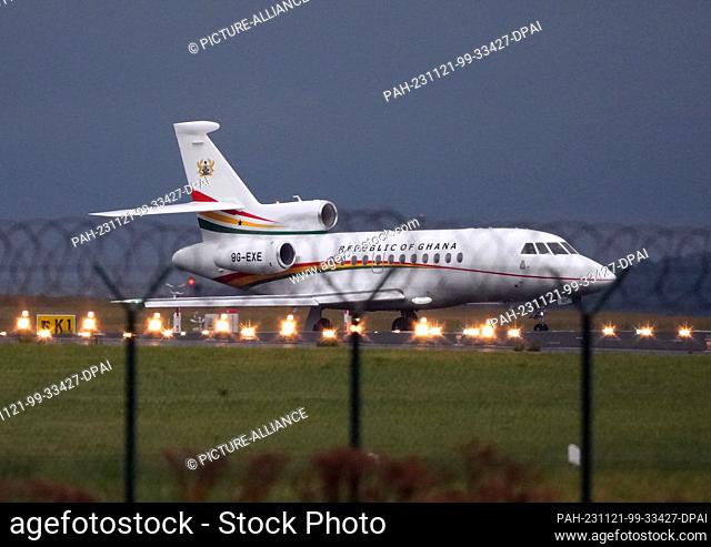 PRODUCTION - 21 November 2023, Brandenburg, Schönefeld: A Dassault Falcon 900EX aircraft with the lettering ""Republic of Ghana"" and the registration 9G-EXE...