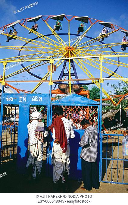 People enjoying giant wheel in Ravechi fair , Kutch , Gujarat , India