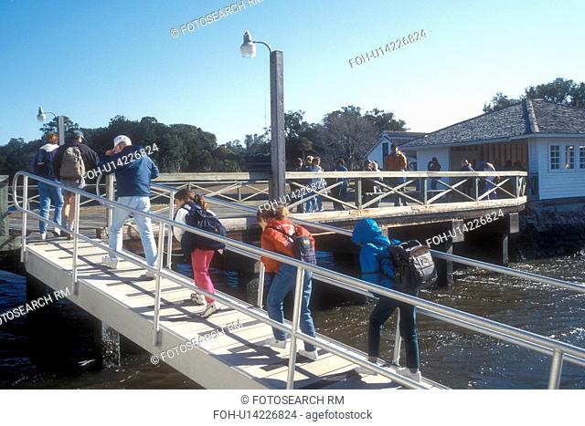 Cumberland Island, Georgia, A group day hikers unloading from the Cumberland Princess passenger ferry at Dungeness Dock on Cumberland Island National Seashore