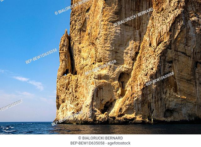 Alghero, Sardinia / Italy - 2018/08/09: Limestone cliffs of the Capo Caccia cape at the Gulf of Alghero