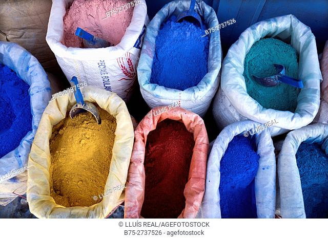 Sacks of dyes for dyeing lime and paint of different typical colors. Chaouen, Morocco