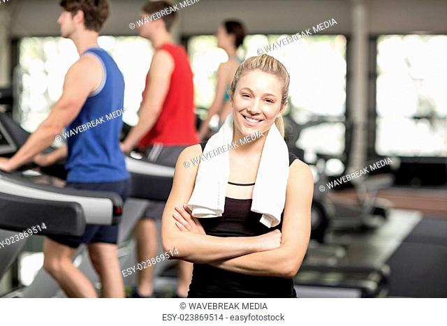 Fit woman posing with arms crossed