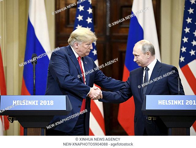 (180716) -- HELSINKI, July 16, 2018 (Xinhua) -- U.S. President Donald Trump (L) shakes hands with Russian President Vladimir Putin during a joint press...