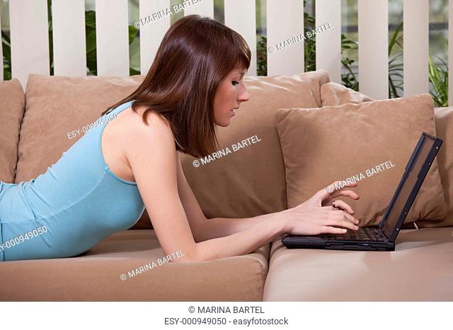 female with laptop at home