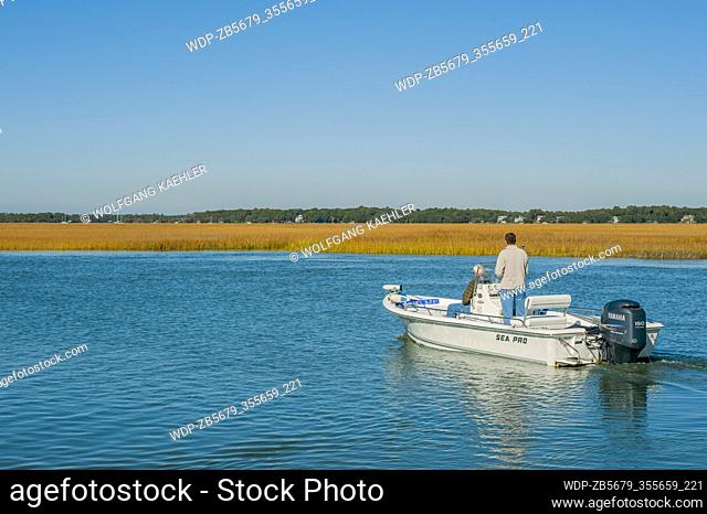 Men in a powerboat on the Intracoastal Waterway at Edisto Island in South Carolina, USA