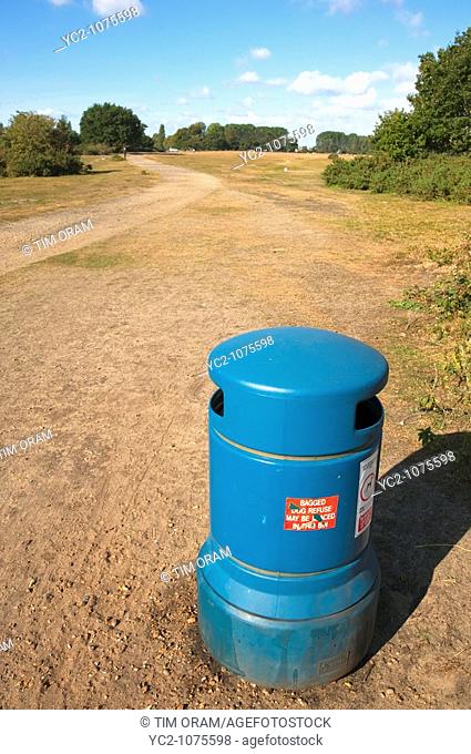 A bin for depositing dogs mess at the common in Beccles , suffolk , Uk