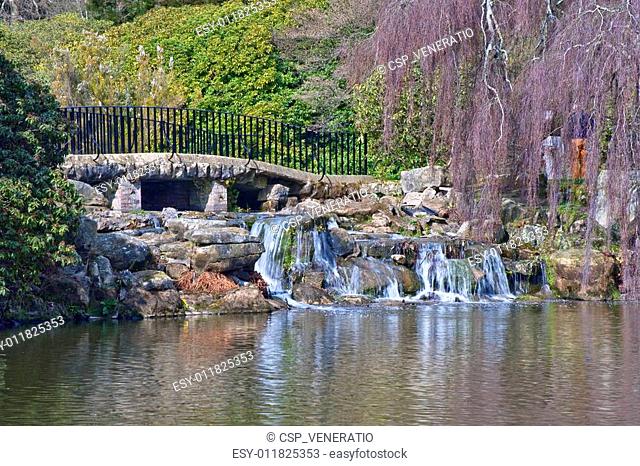 Lovely natural ornamental gardens in Spring with lake and waterfall