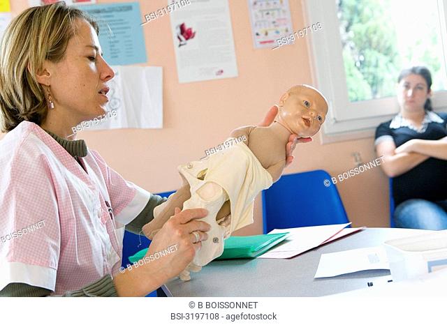 Photo essay at the hospital of Meaux 77, France. The midwife is showing different possible presentations of the head of the newborn baby during the delivery