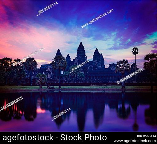 Vintage retro effect filtered hipster style image of Angkor Wat, famous Cambodian landmark, on sunrise. Siem Reap, Cambodia, Asia