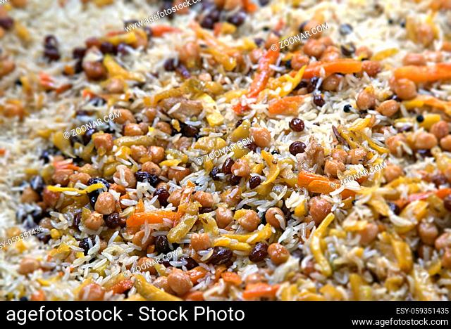 Close-up of uzbek pilaf with raisins and chickpeas