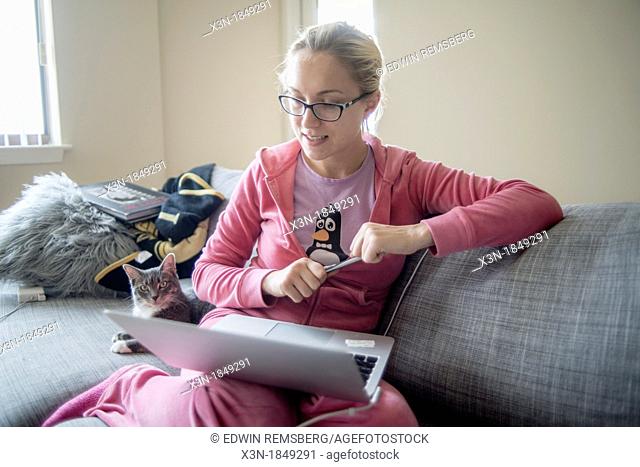 Blonde student working at computer