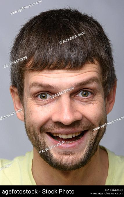 Close-up portrait of a very happy man
