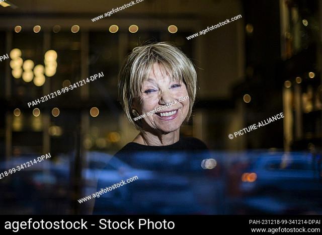 PRODUCTION - 18 December 2023, Berlin: Judy Winter, actress, stands at the window of a Charlottenburg café at the end of an interview with the Deutsche...