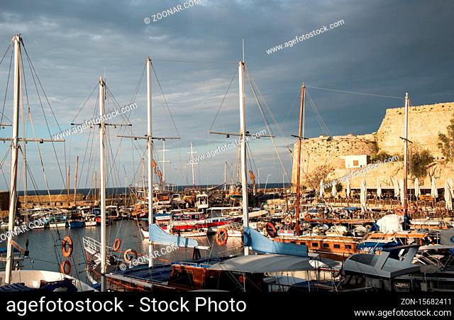 Harbor filled with yachts and boats at sunset at Kerynia city harbor in Cyprus