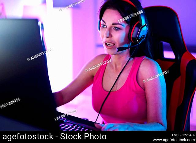 Online Player Woman In Headset Using Computer