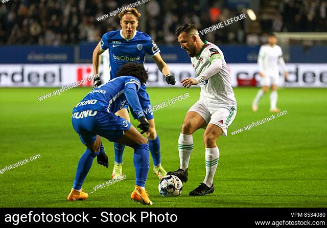 Genk's Angelo Preciado and OHL's Xavier Mercier fight for the ball during a soccer match between OHL Oud-Heverlee-Leuven and KRC Racing Genk