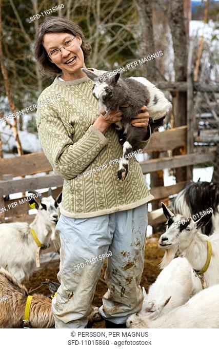 Farmer with goats