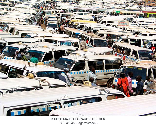 An ocean of mini-buses serve the people of downtown Kampala, Uganda during the rush hour. Actually the rush hour is the whole day and most of the evening
