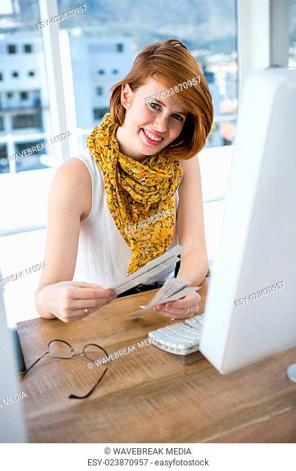 smiling hipster business woman looking at colour swatches
