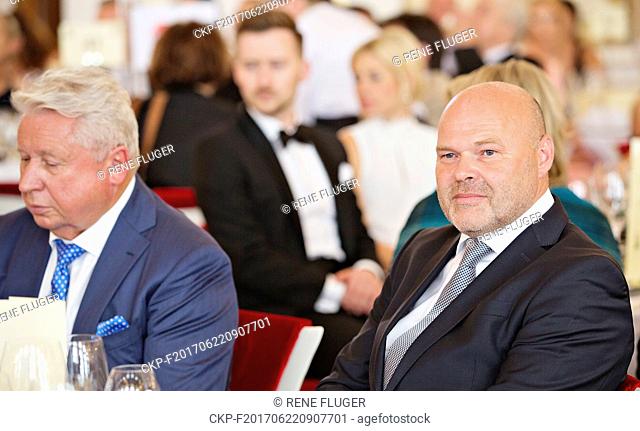 Sports manager Miroslav Cernosek, left, physiotherapist Pavel Kolar, right, internationally popular Czech pop star Karel Gott, and Ivana Trump