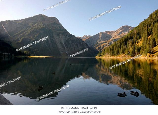 The mountains in the Tannheimer Valley in Tyrol / Austria are reflected in the clear waters of the Vilsalpsee