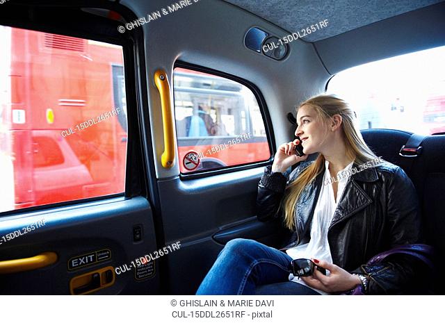 Woman on the phone, in taxi