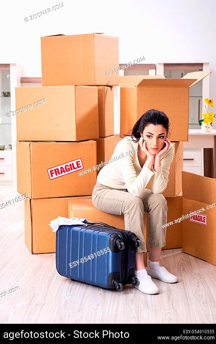 Young woman moving to new flat
