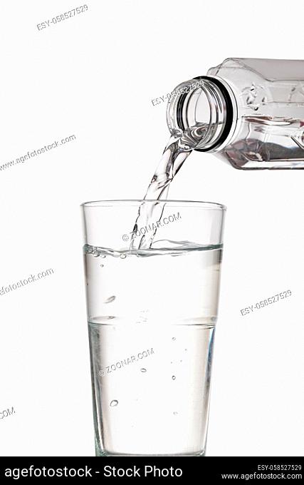 water bottle pour water to glass on white background