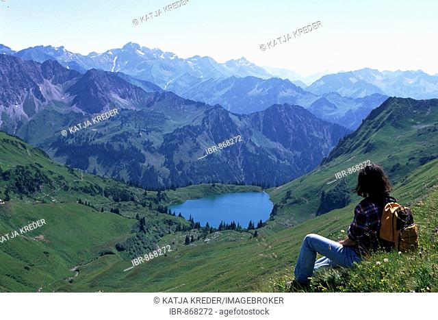 Female hiker on Alpsee Lake, Nebelhorn, Oberstdorf, Allgaeu region, Bavaria, Germany, Europe