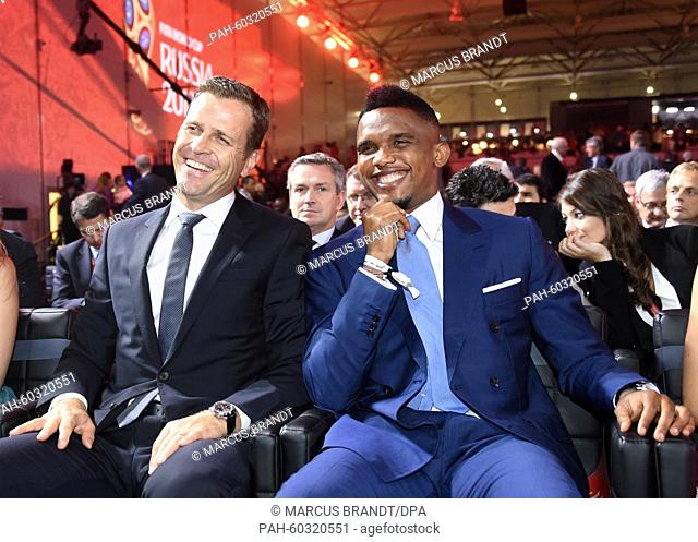 Manager of the German national team Oliver Bierhoff (L) and soccer player Samuel Eto'o sit ahead of the Preliminary Draw for the FIFA World Cup 2018, in St