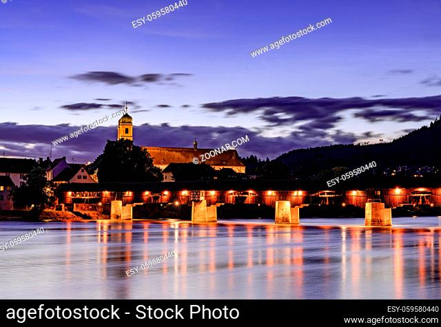 Bad Saeckingen, BW / Germany - 4 July 2020: view of the St. Fridolin cathedral and Rhine bridge in Bad Saeckingen at sunset