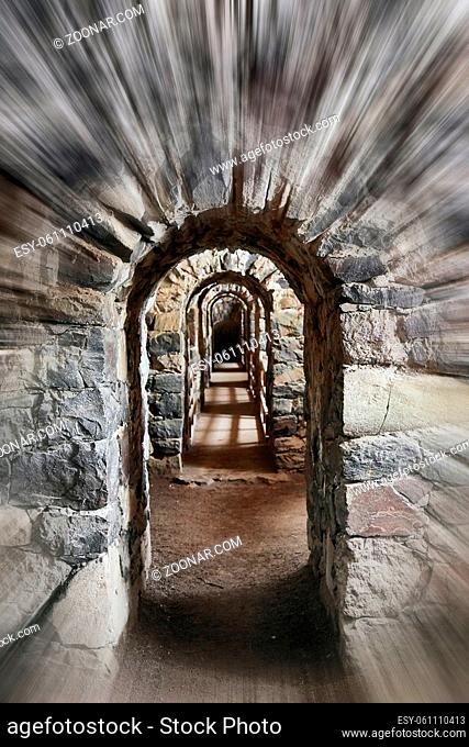 Old stone arch in a castle with rushing motion blur