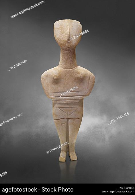 Cyclades spedos type stone statue figurine with folded arms, Archanes Phourni, 2300-1700 BC. Heraklion Archaeological Museum, grey background.