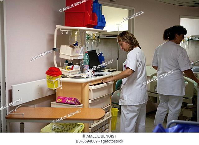 Photo essay at Laennec hospital in Creil, France. Mobile unit with computer containing files of each patient and associated treatments
